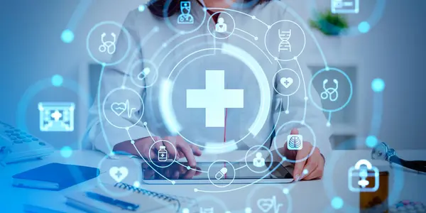 A doctor at a desk with a tablet, surrounded by a holographic overlay of clinical icons