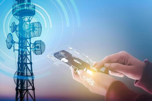 A telecom antenna tower broadcasting to a smartphone surrounded by connectivity icons